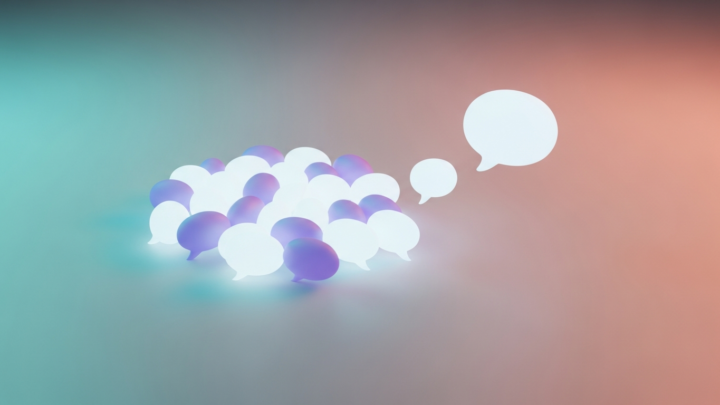 Soft glowing speech-bubble shapes with one drifting away from the group toward open space