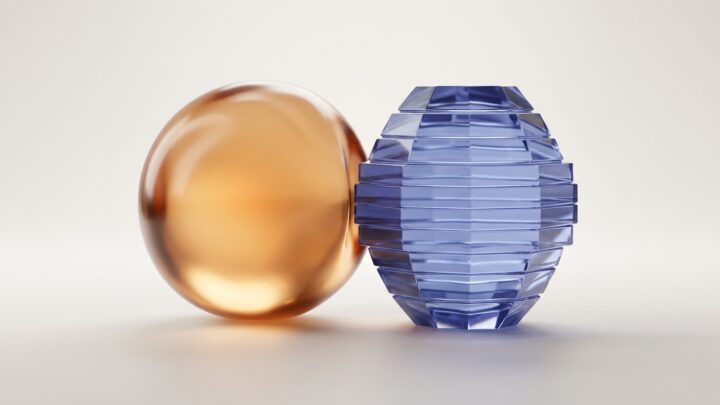 Abstract editorial render: a smooth warm-amber sphere beside a cool-blue layered crystal, representing two contrasting AI memory architectures